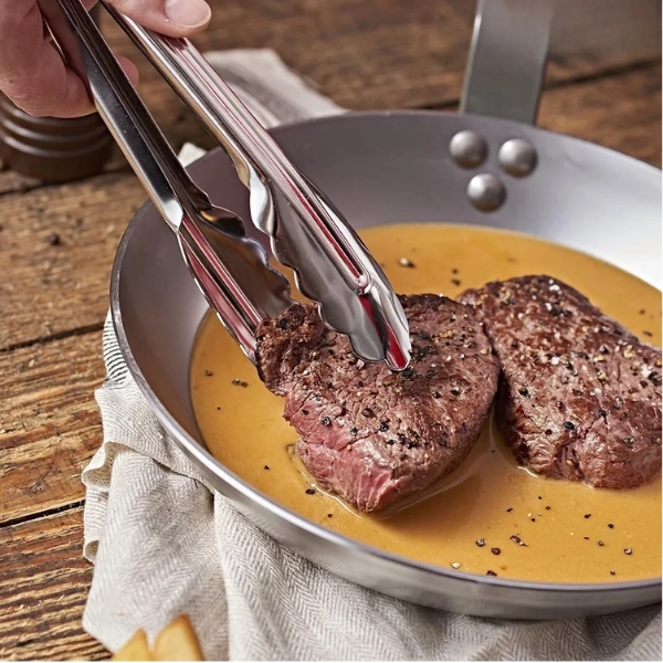 pince de service inox 24 cm avec embouts feuille de chêne pour retourner la viande en cuisson